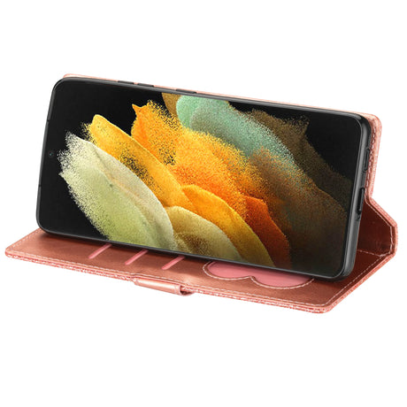 Smartphone with a colorful abstract display in a rose gold wallet case.