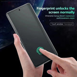 Smartphone with a fingerprint sensor being unlocked by a finger touch.