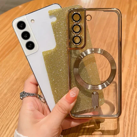 Smartphone with a glittery gold case featuring a ring holder and transparent elements.