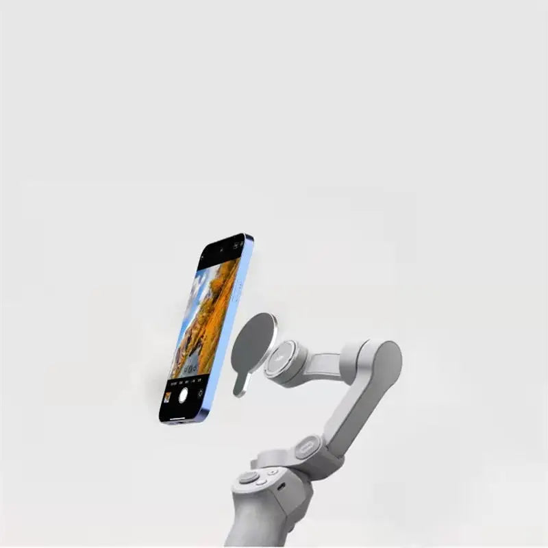 a robot holding a cell phone in its hand