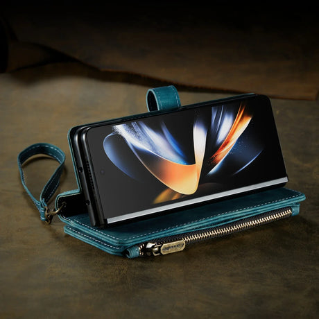 Smartphone in a teal leather wallet case with a wrist strap.