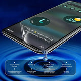 a smartphone with water on it and a glass of water