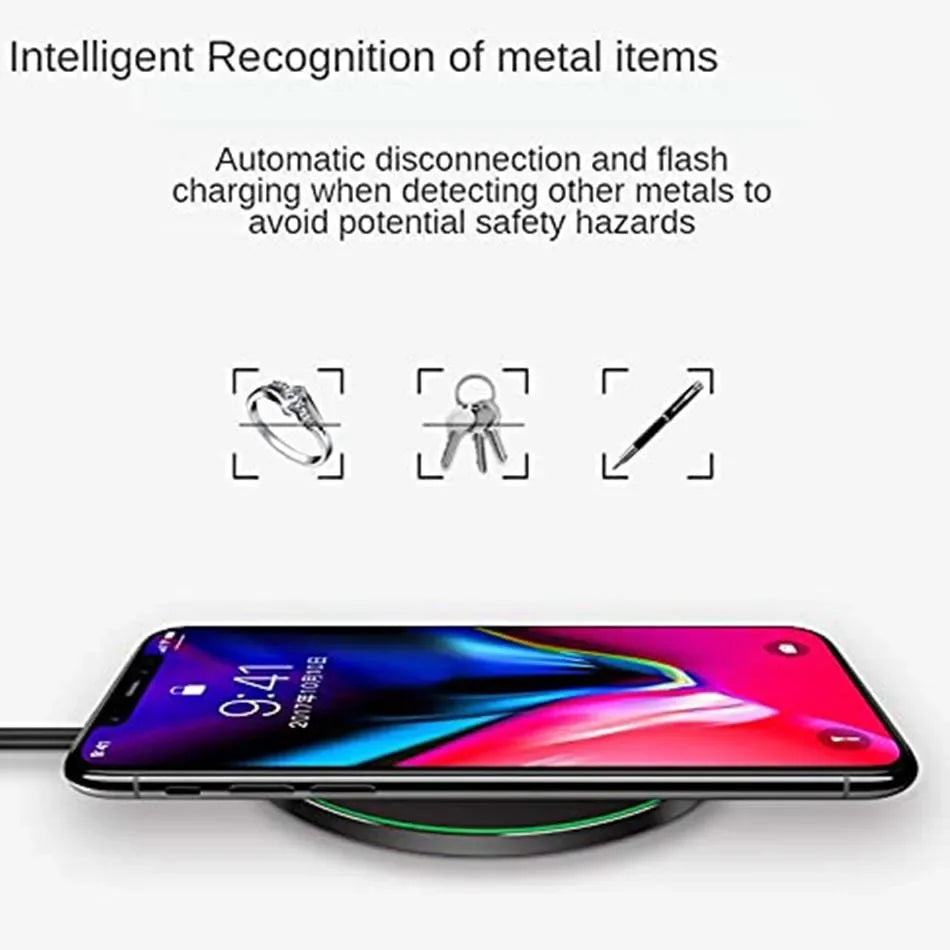 Smartphone lying on a wireless charging pad with colorful screen display.