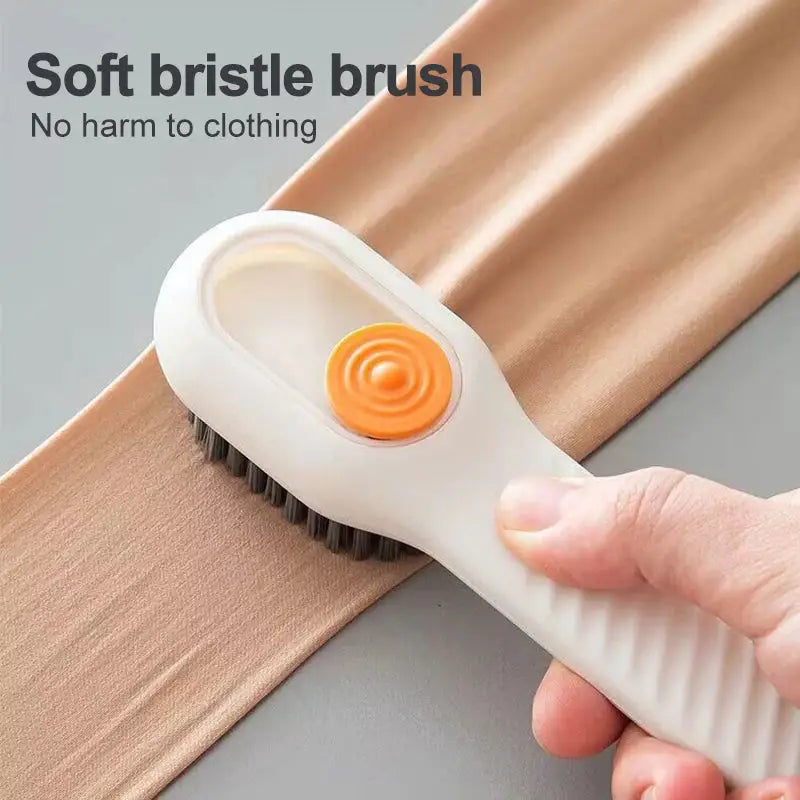 someone is using a brush to clean a piece of fabric