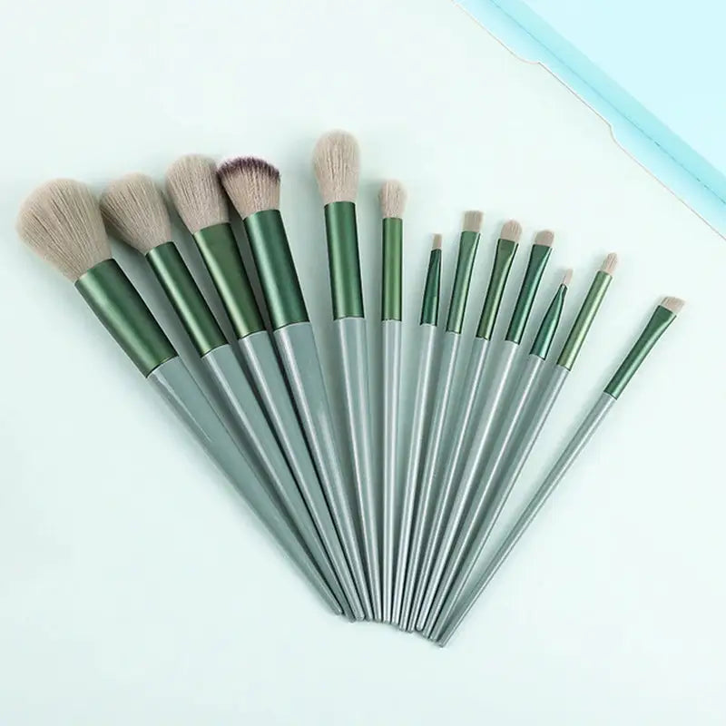 a set of makeup brushes on a white surface