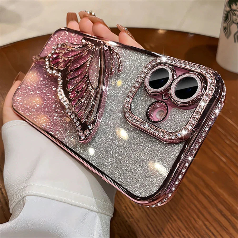 Sparkly phone case with butterfly and rhinestone accents.