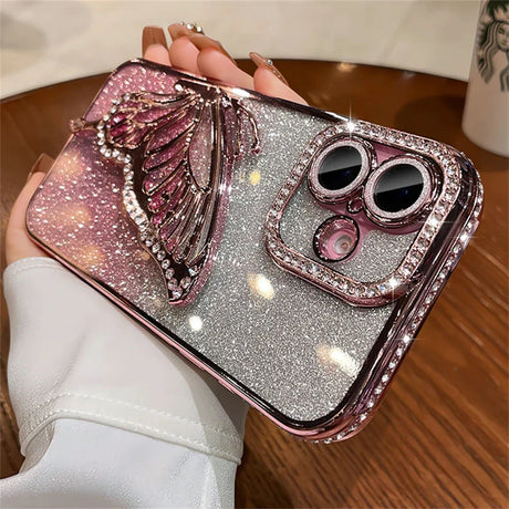 Sparkly phone case with butterfly and rhinestone accents.