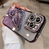 Sparkly phone case with butterfly and rhinestone camera surround.