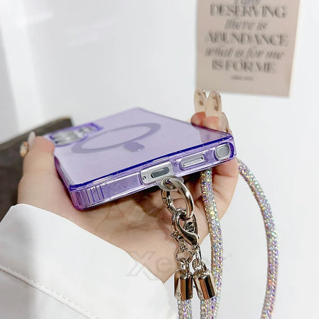 Sparkly purple phone case with rhinestone strap.