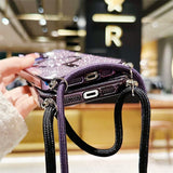 Sparkly purple phone cases with straps.