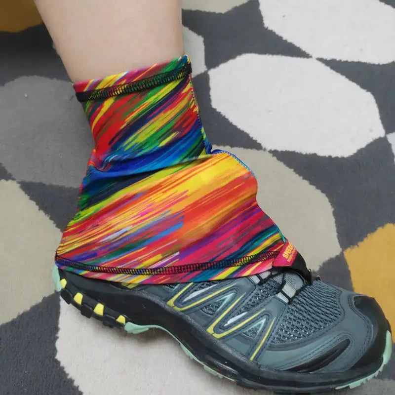 a person wearing colorful socks and running shoes