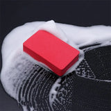 a red sponge on top of a black sponge