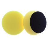 two sponges with black and yellow foam