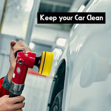 a man is using a spray gun to clean a car