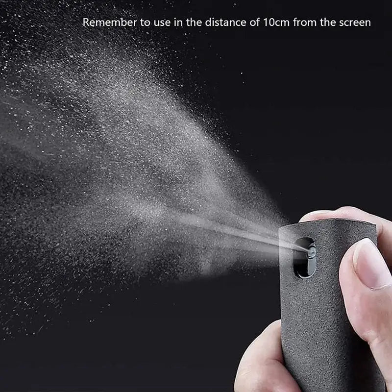 someone is spraying water on a black device with a spray gun
