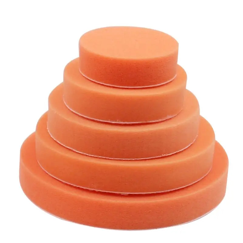 a stack of orange sponges