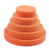 a stack of orange sponges