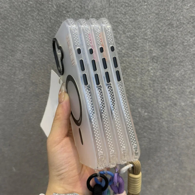 Stack of transparent smartphone cases with MagSafe rings and lanyard attachments.