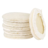 a stack of white sugar cookies with a half cut in half
