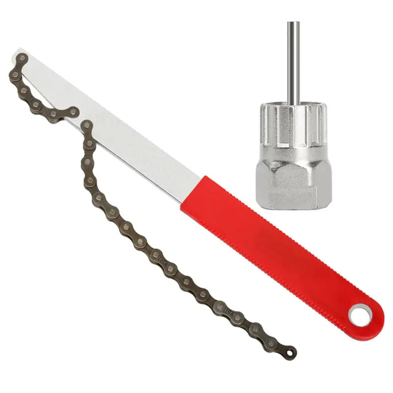 a close up of a chain saw and a tool on a white background