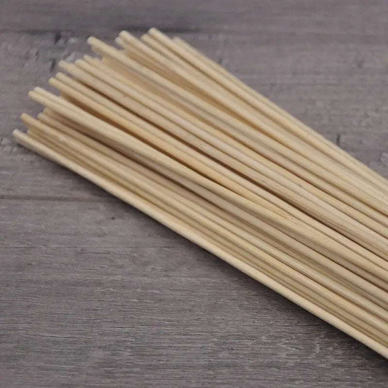 a bunch of bamboo sticks on a wooden table