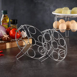 a stainless wire rack with eggs and vegetables