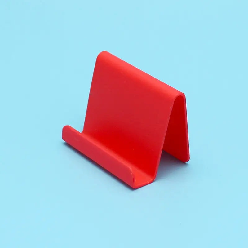 a red plastic stand on a blue background