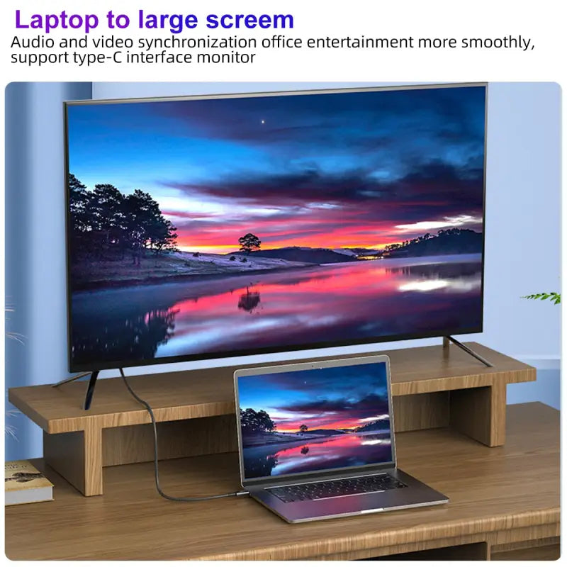 a tv with a laptop on it