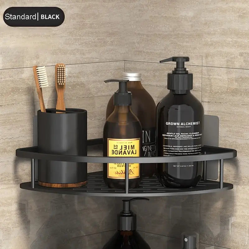 a black shelf with a bottle and toothbrushs on it