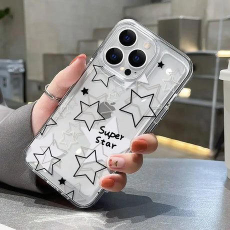 a woman holding a phone case with stars on it