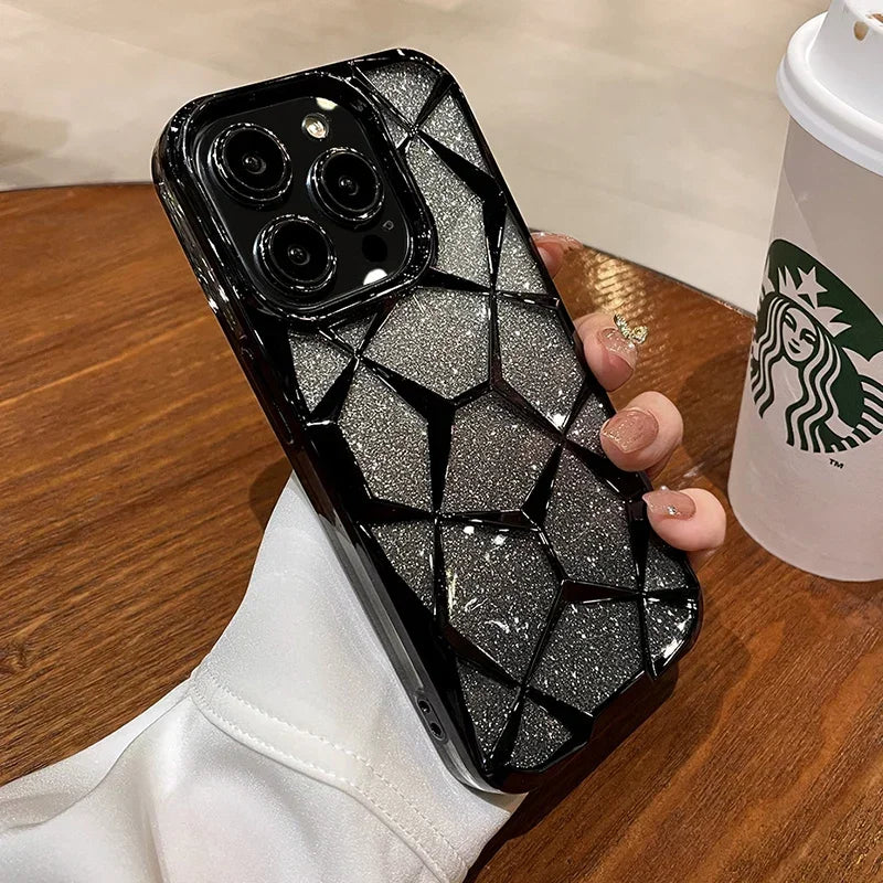 someone holding a starbucks cup and a black case with a diamond design