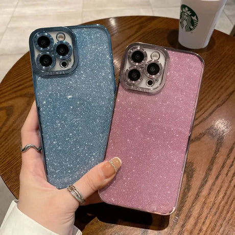 someone holding a starbucks cup and a pink and blue iphone case