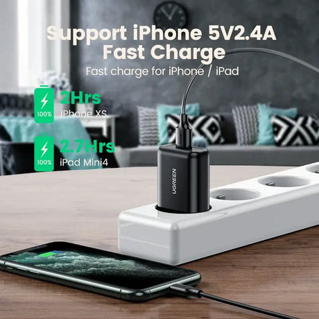 A charging station with a phone and a charging cable