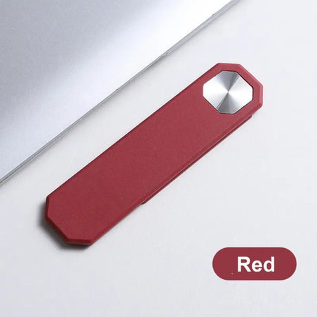 a red usb stick sitting on top of a laptop