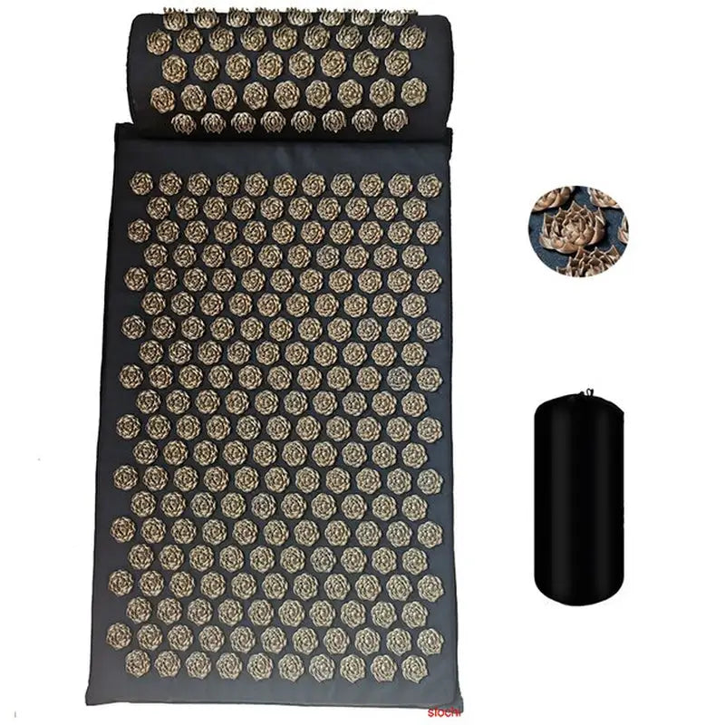 a black yoga mat with a gold and black pattern