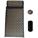 a black yoga mat with a gold and black pattern