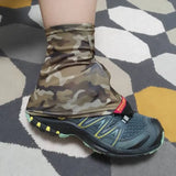 a person wearing camouflage boots