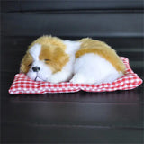 a stuffed dog is laying on a red and white checkered blanket