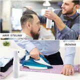 a man is ironing his hair with a iron