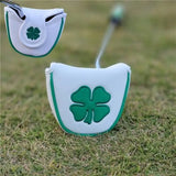 a golf putter’s putter with a green shamrock on it