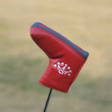 a golf club head cover with a red and black design