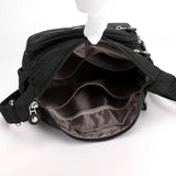 a black purse bag with a zipper