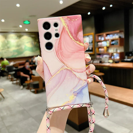 Stylish smartphone case with a pink and pastel marble-like design and multiple camera cutouts.