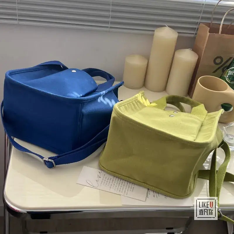 a table with a bag and a candle