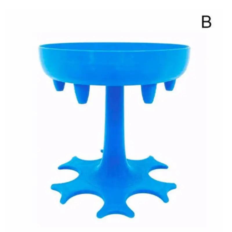 a blue plastic table with a small bowl on top