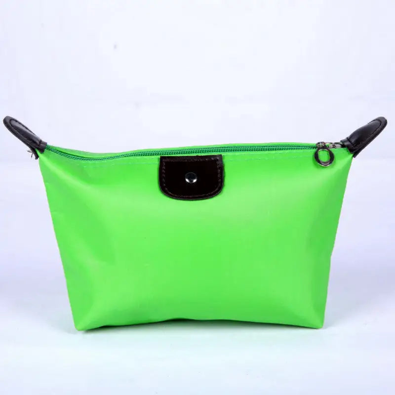 a green cosmetic bag with black handles