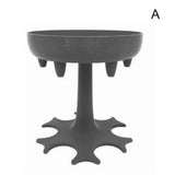 a black plastic table with a white background