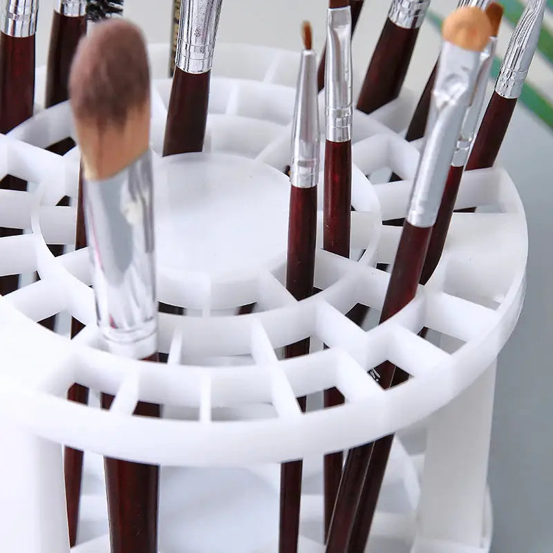 a white container with brushes and brushes in it