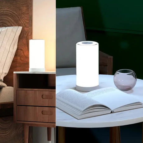 A table with a lamp and a book on it