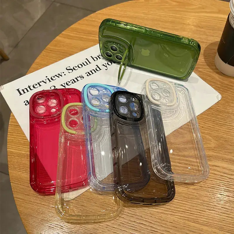 a table with three different colored cases on it